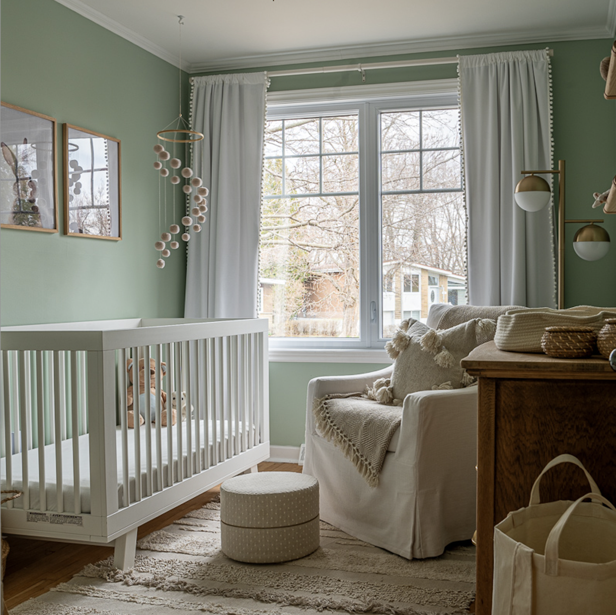 O'Brien nursery — sage green walls, natural wood, non-toxic materials