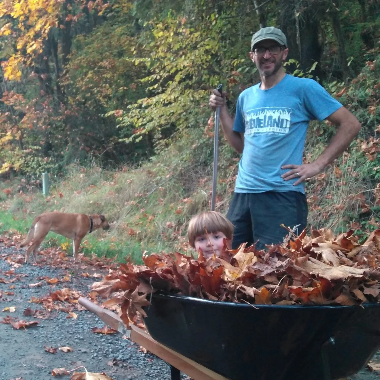 Jesse Wolfe with son on his organic farm in Oregon's Coast Range