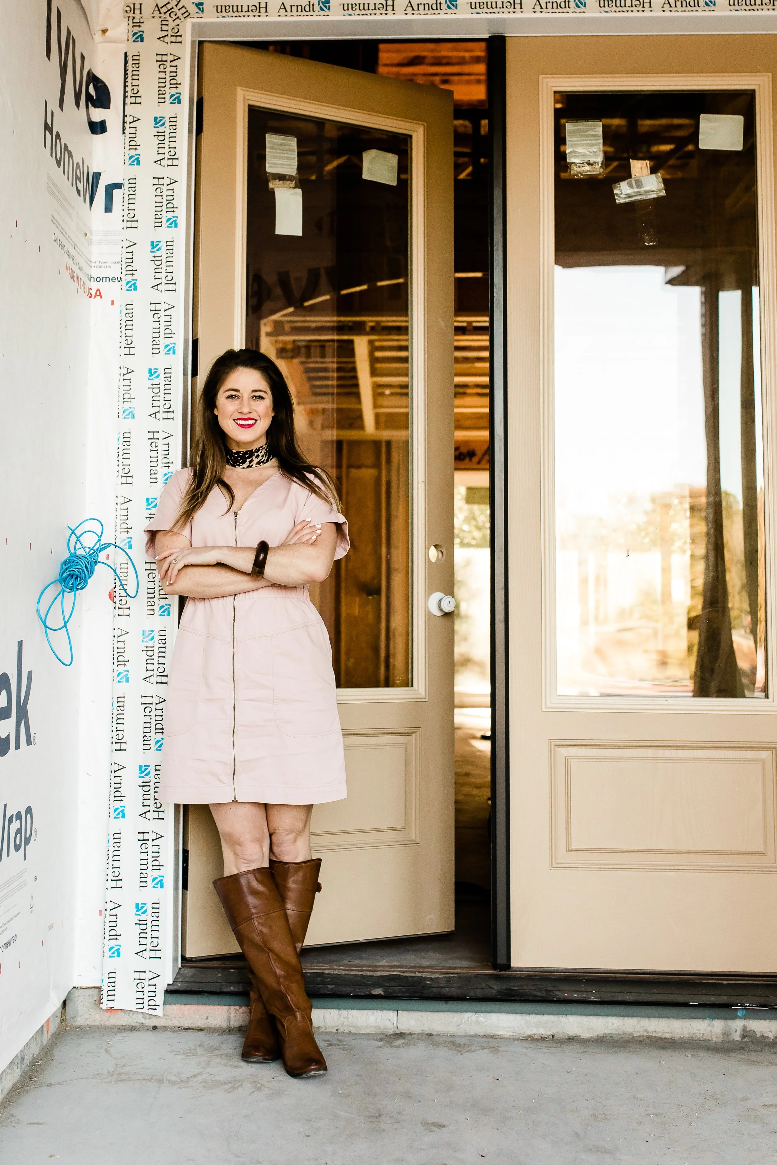 Lauren Riddei at a construction site with Tyvek house wrap