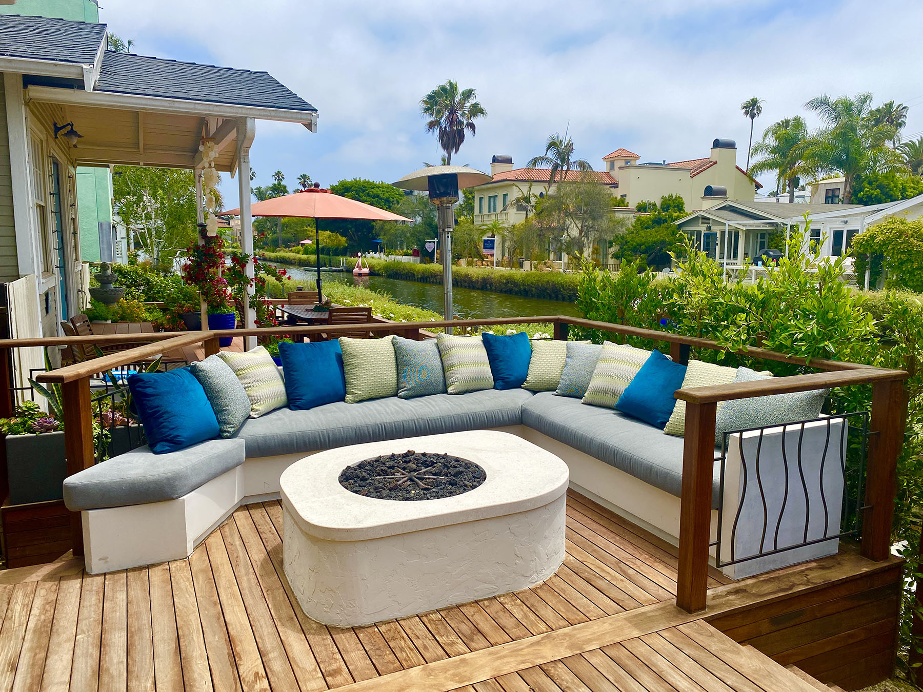 Venice Canals patio with built-in seating and fire pit overlooking the canal