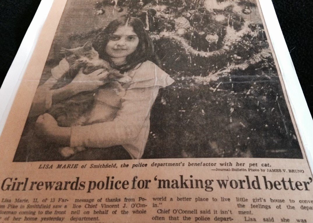 A newspaper clipping showing Lisa as a child.