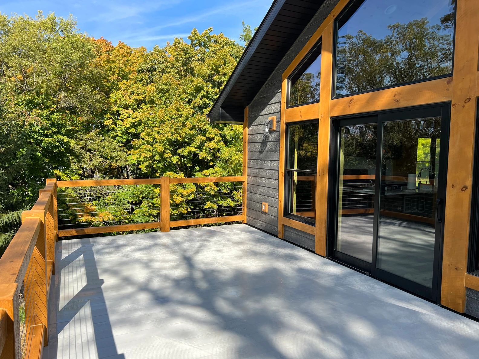 PLH Exclusives real build — modern rustic deck with timber and cable railing