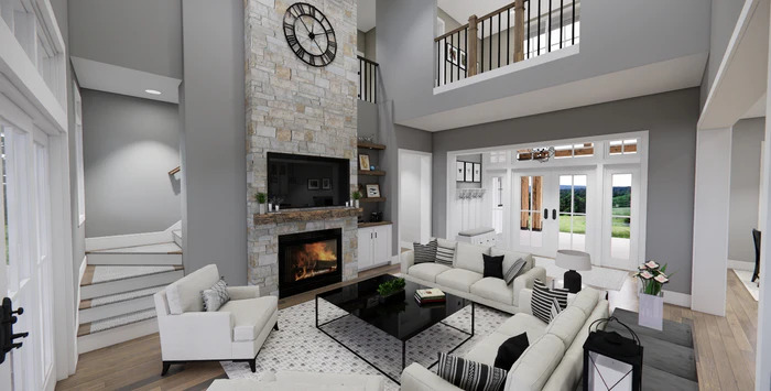 Pebble Creek great room — stone fireplace, vaulted ceiling, French doors