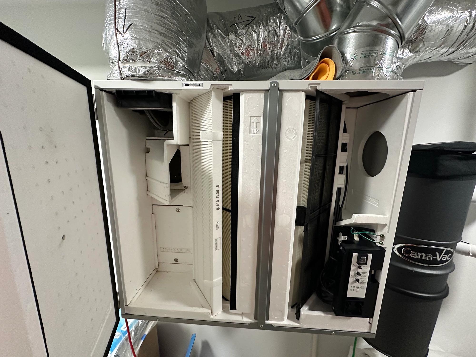 Ventilation unit interior showing HEPA filter and pre-filter stages