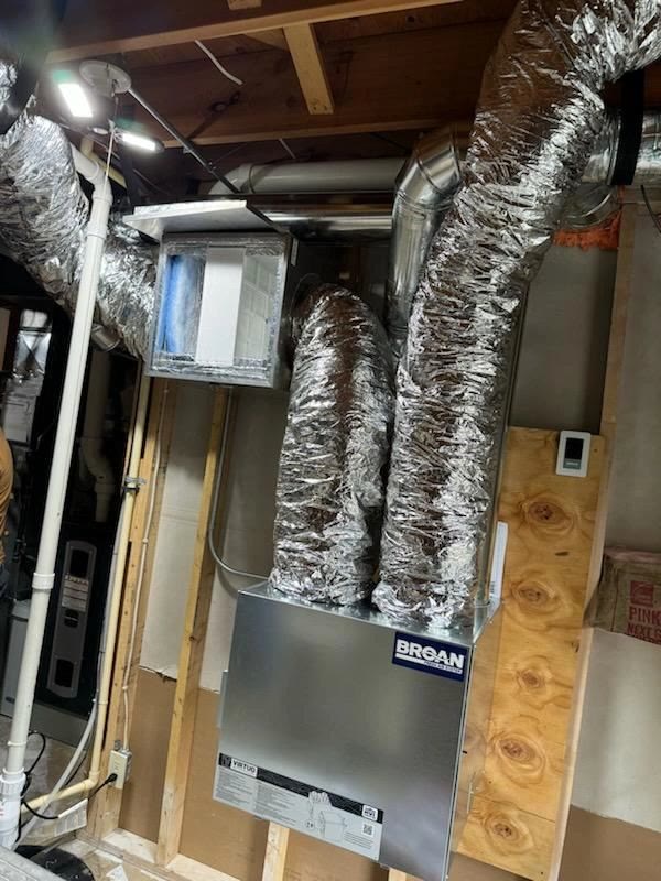 Broan ERV with insulated flex duct runs in a residential basement