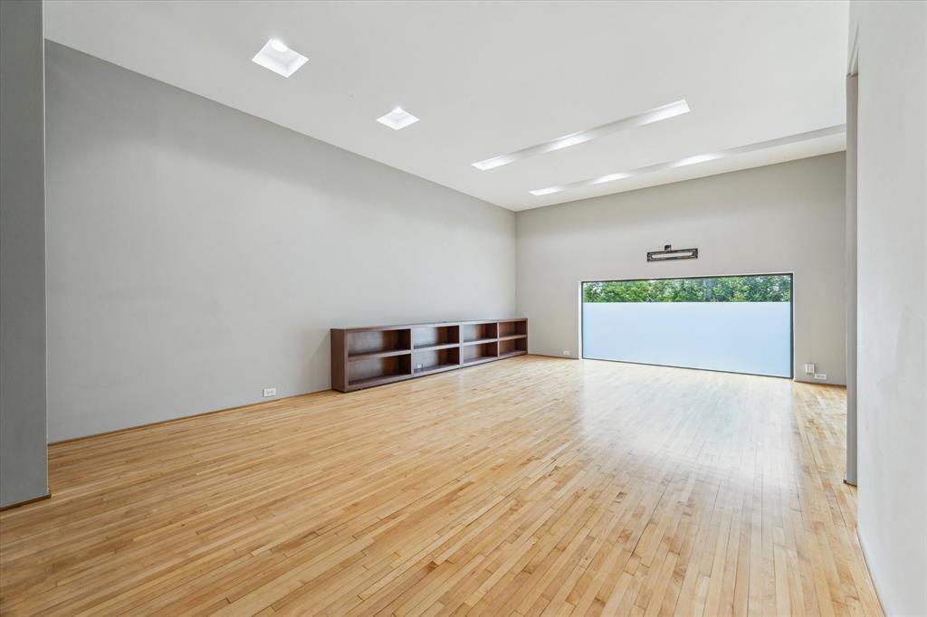Living area at 730 Tulane St D — open-plan interior with light hardwood floors and clean sightlines